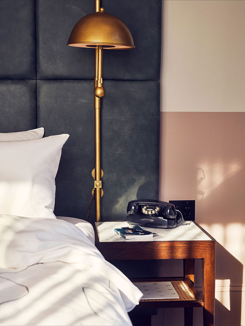 Side table and light in hotel room