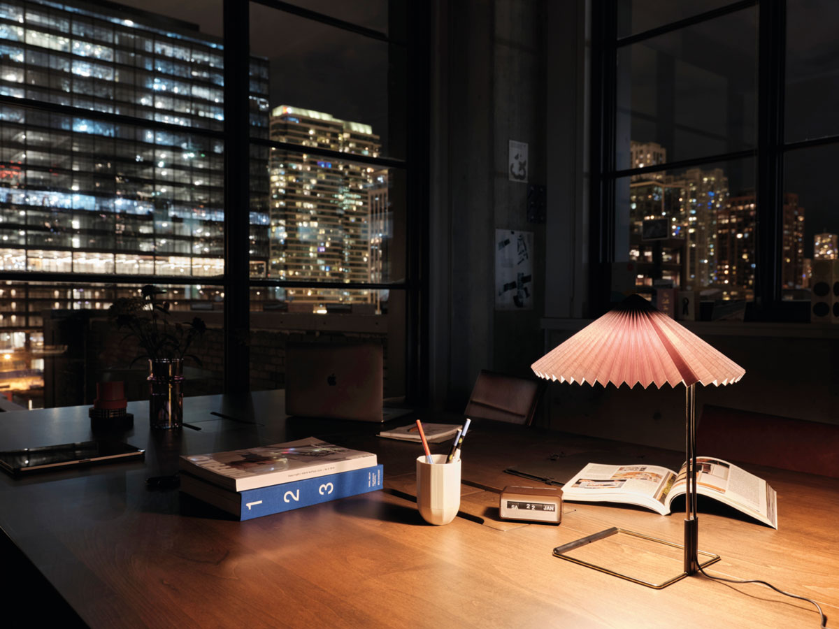 Office in the evening with light from a desk lamp