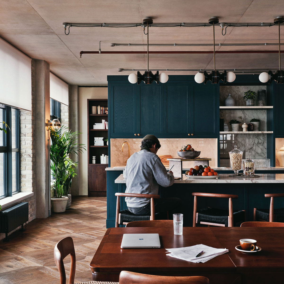 Man sitting working in pantry area