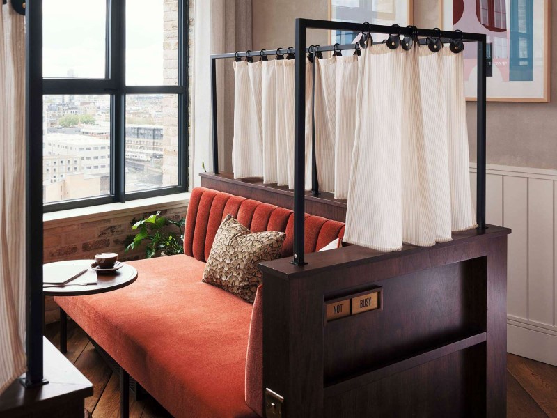 Day bed with privacy curtain and view across London