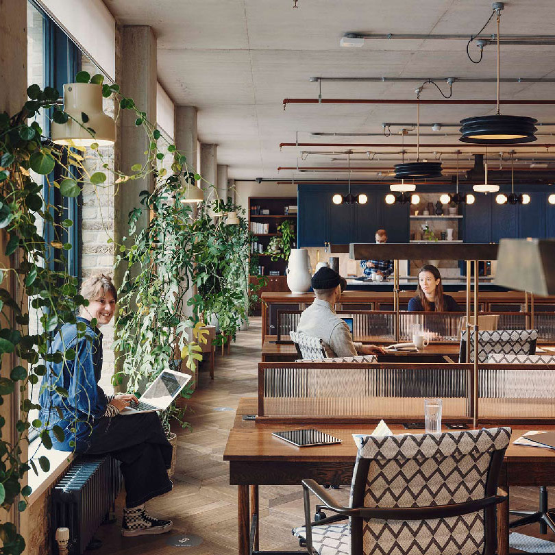 People working in the hot desking area