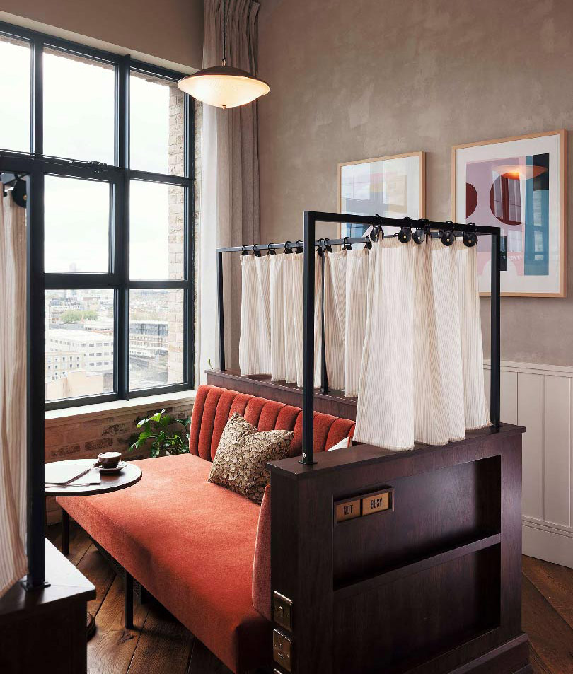 Day bed with privacy curtain and view across London