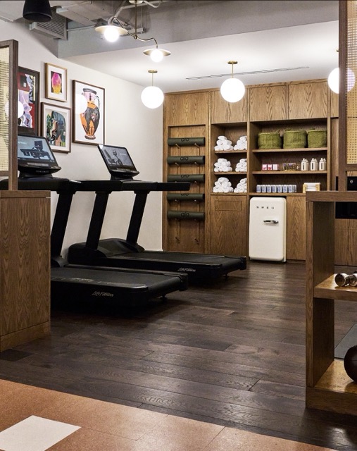 Working From Fulton Market Gym studio with shelves of gym equipment, mini fridge, towels and other essential stuff for your gym workout